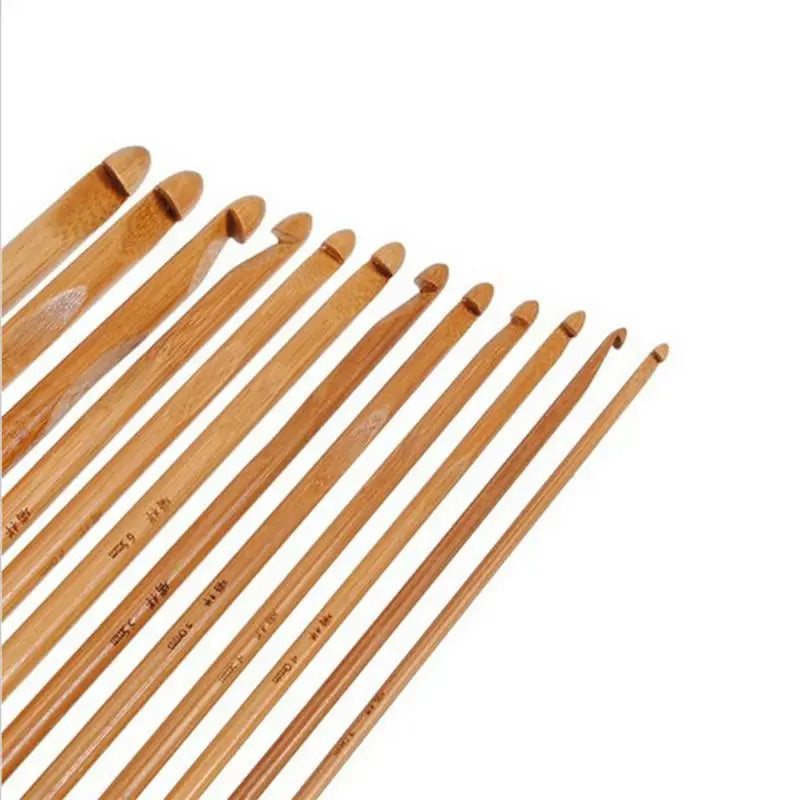 A set of Bamboo Crochet Hooks 12 Pcs arranged in a row, varying in size from large to small, perfect for sustainable crafting.