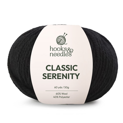 A ball of black Classic Serenity Yarn, super bulky, 60 yards/50g, made from a soft wool-polyester blend—ideal for chunky blankets and cozy projects.