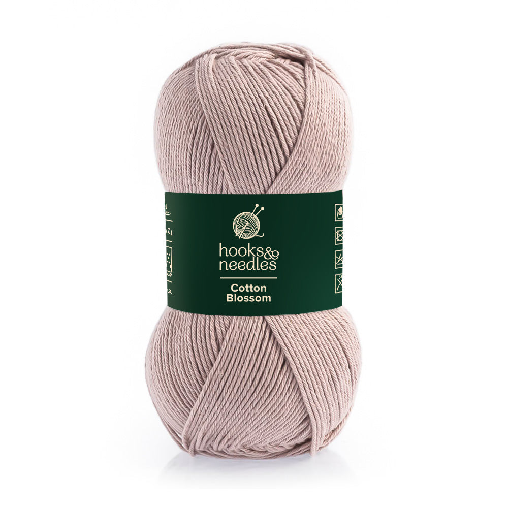 Skein of Cotton Blossom eco-conscious 100% cotton yarn with brand label.