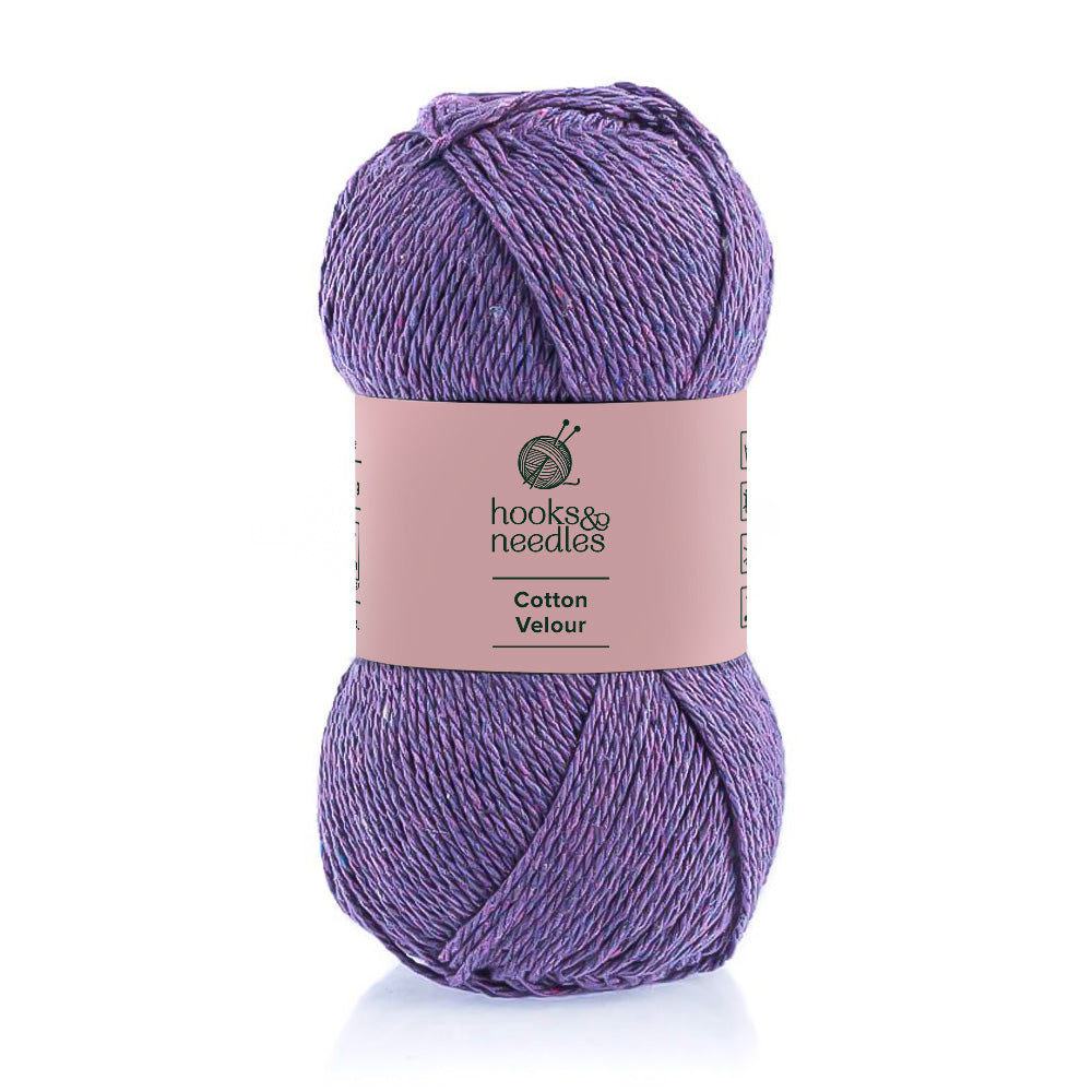 A skein of purple Cotton Velour yarn, known for its hypoallergenic qualities, against a white background.