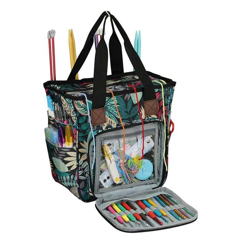 A colorful Yarn Organizer tote bag with multiple pockets, filled with art supplies like markers, pencils, knitting needles, and crocheting essentials.