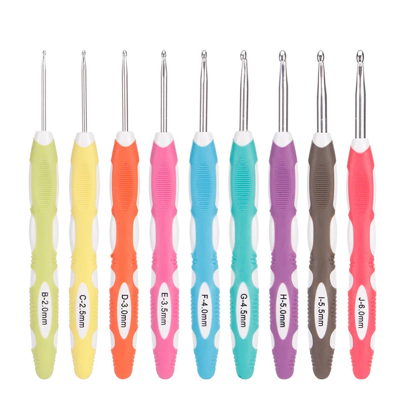 A Crochet Hook Set 9 Pcs with Soft Grip Handles, arranged in a row, each labelled with its respective size ranging from B 2.0mm to J 6.0mm.
