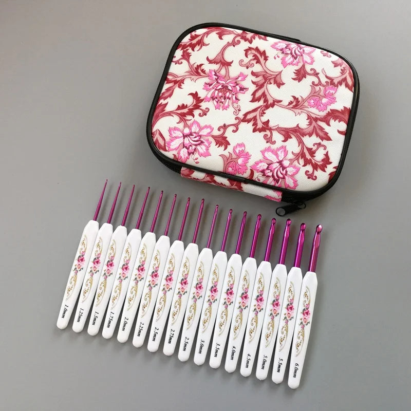 Crochet Hook Set 16 Pcs with Case, arranged in a row beneath a zippered floral-patterned case on a grey background.