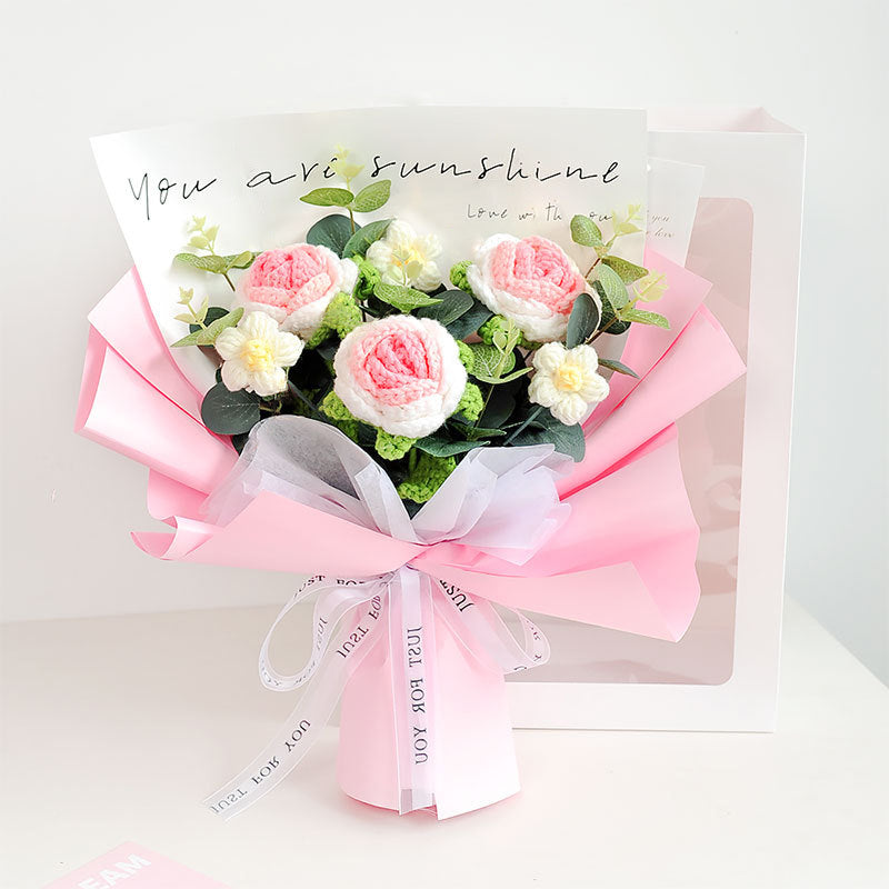 The Crochet Rose Bouquet - Timeless Blooms (Bundle51) includes pink and white handcrafted roses beautifully wrapped in pink paper and comes with a message card that reads "You are sunshine.