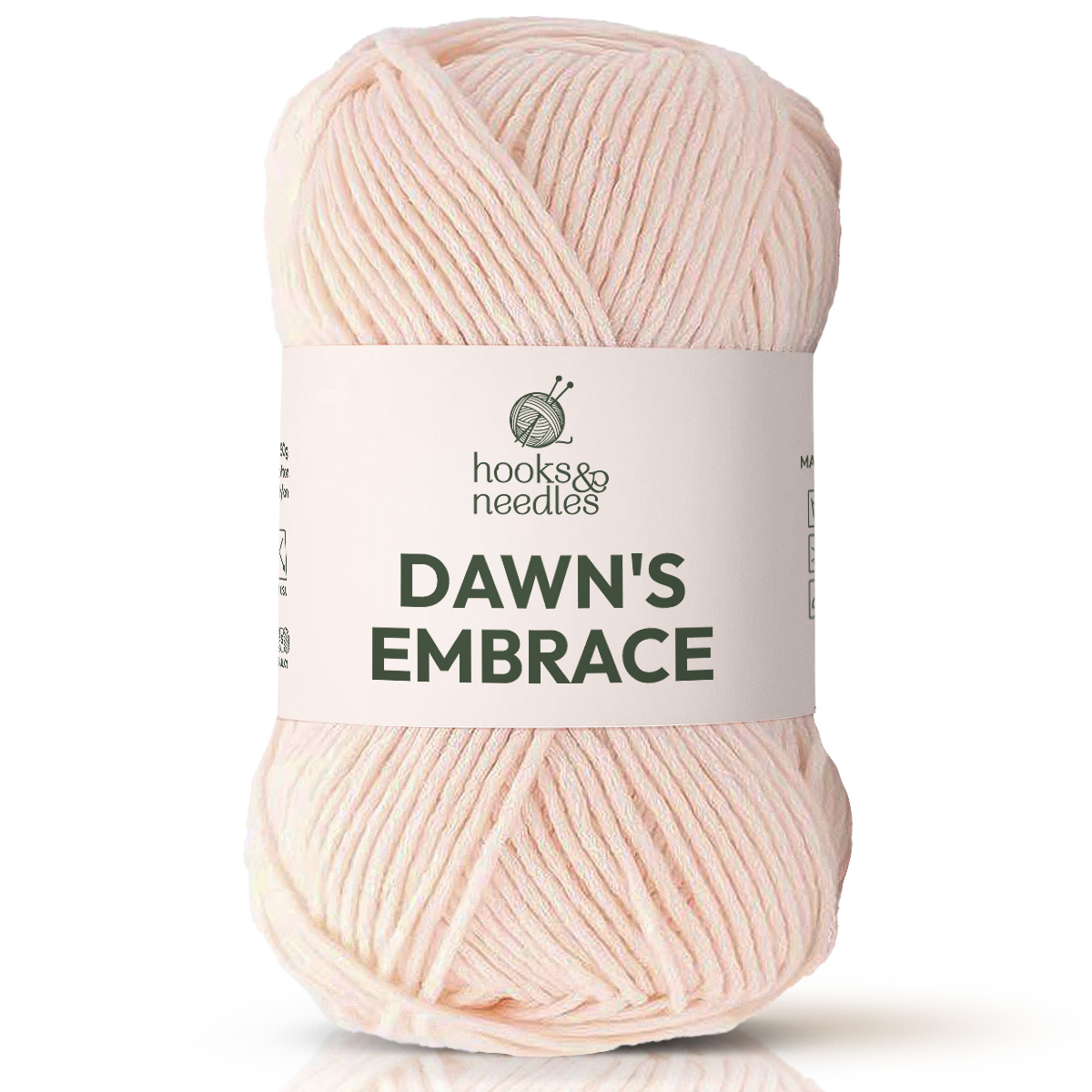 A skein of pale pink bulky Dawn's Embrace Yarn with a knitting needles and yarn logo—perfect cozy blanket yarn for your next project.