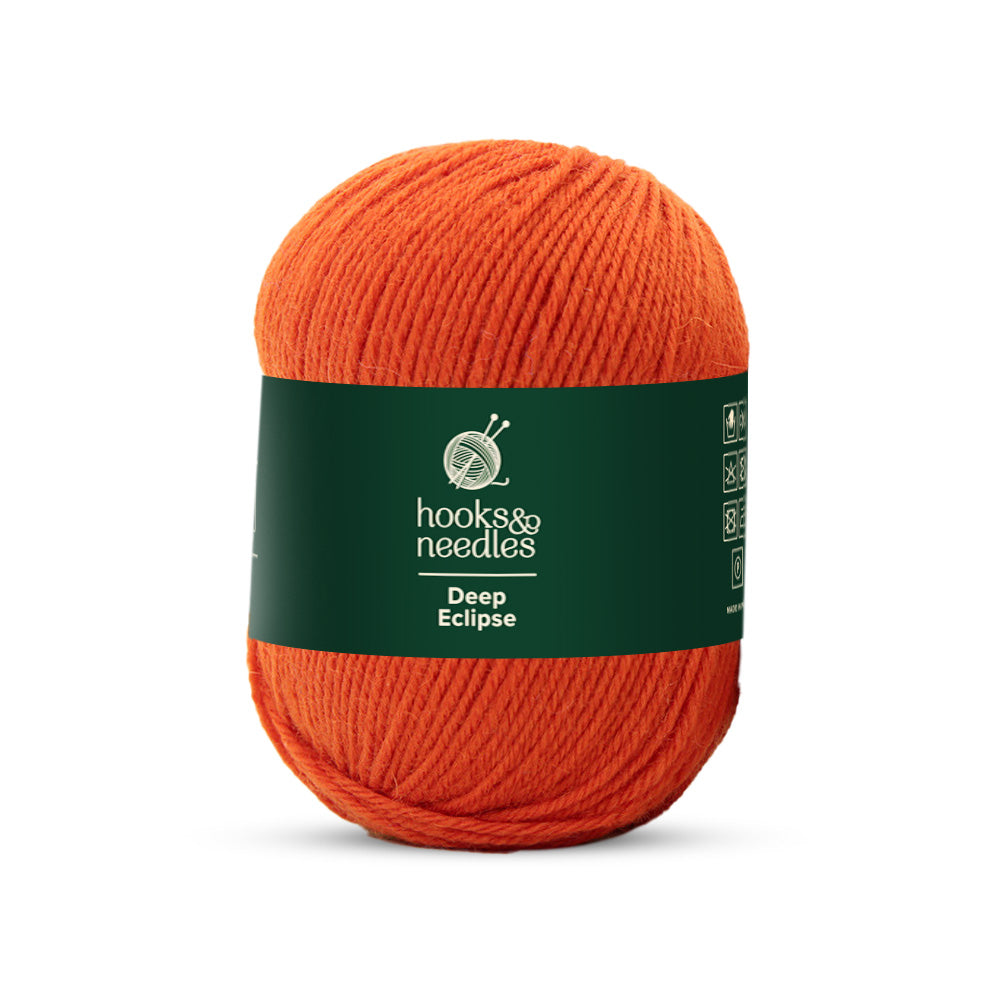 A 100g skein of medium-weight, 100% wool yarn named "Deep Eclipse" with a dark green band.