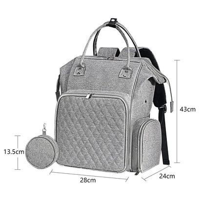 The Oxford Serenity Luxe Bag (bundle) is a gray diaper bag backpack made from durable 600D Oxford fabric. It measures 43 cm in height, 28 cm in width, and 13.5 cm in depth, featuring multiple compartments along with a detachable round pouch to neatly store your essentials.