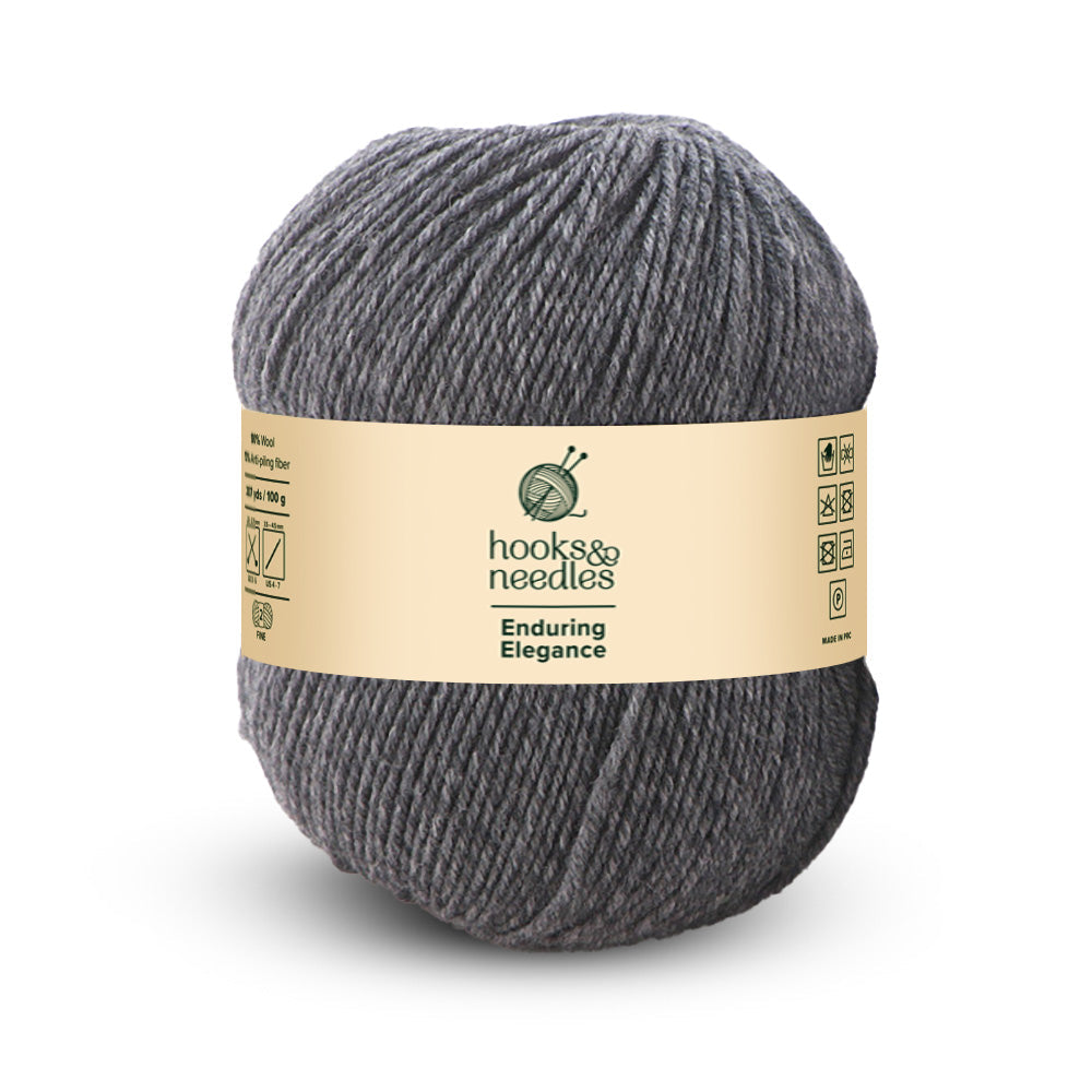 The "Enduring Elegance Yarn 100g" from Hooks & Needles is a fine-weight skein in an elegant gray, designed for enduring beauty with anti-pilling wool technology.