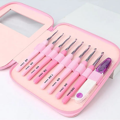 A premium Ergonomic Crochet Hook Set 9 Pcs with Case in pink, featuring ergonomic crochet hooks of varying sizes, all secured in a matching pink zipper case for pain-free crocheting.