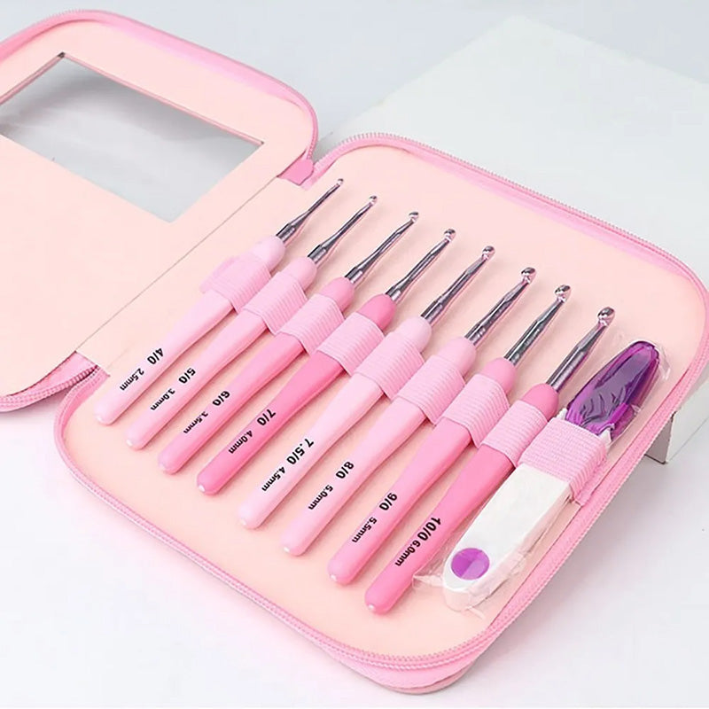 A premium Ergonomic Crochet Hook Set 9 Pcs with Case in pink, featuring ergonomic crochet hooks of varying sizes, all secured in a matching pink zipper case for pain-free crocheting.