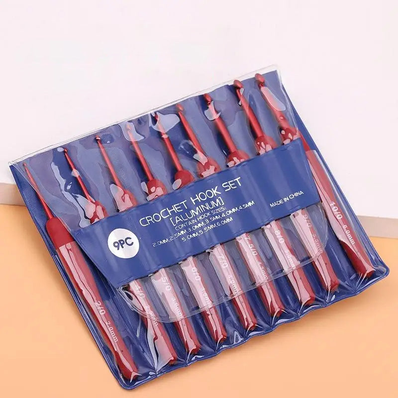 A 9-piece red-handled Ergonomic Crochet Hook Set 9 Pcs with Soft Grip Handles in a clear plastic packaging, labeled with hook sizes ranging from 2.0mm to 6.0mm. Perfect for beginners and experts alike, the packaging reads "Made in China".