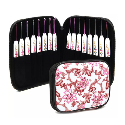 The Crochet Hook Set 16 Pcs with Case features lightweight hooks with artistic white handles and floral accents, all neatly stored in a zippered pink floral case.