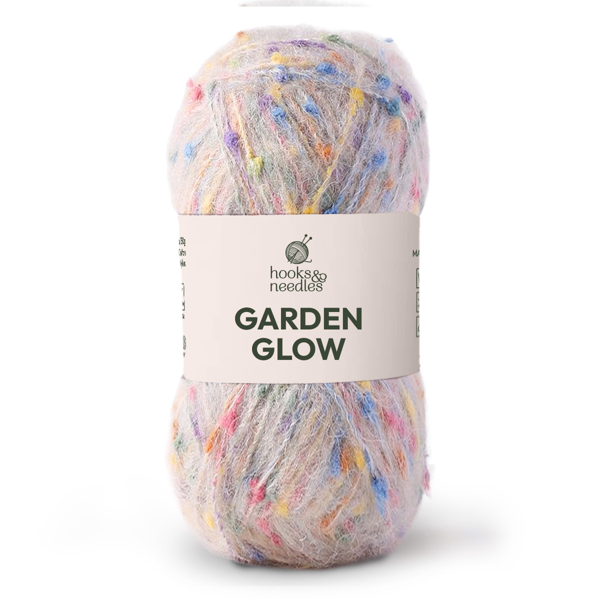 A skein of Garden Glow Yarn—medium weight with pastel flecks on a light base—offers softness and vibrant color, making it perfect for your next creative project.