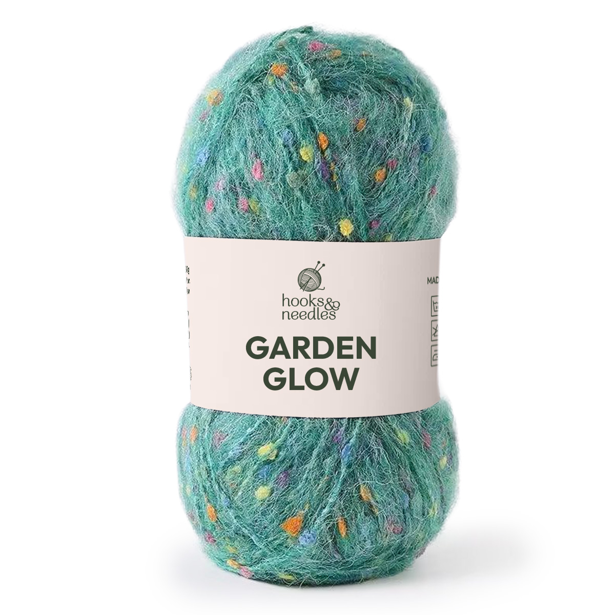 A skein of Garden Glow Yarn in medium weight teal with multicolored flecks is perfect for adding vibrant color and a lively touch to your next project.