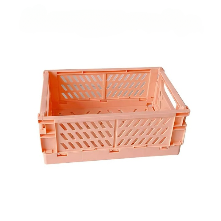 A collapsible storage crate, measuring 10" x 7", in peach-colored plastic with slotted sides and a sturdy frame, perfect for organizing knitting or crocheting supplies.