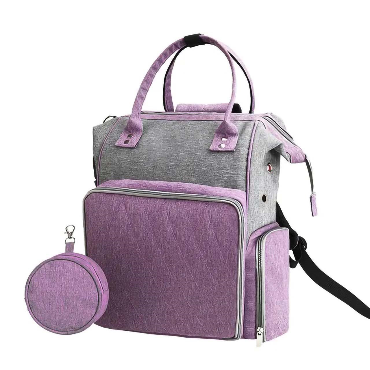 The Oxford Serenity Luxe Bag in Purple and Gray includes multiple compartments and a round detachable pouch, making it ideal for storing crafting tools like hooks and needles.