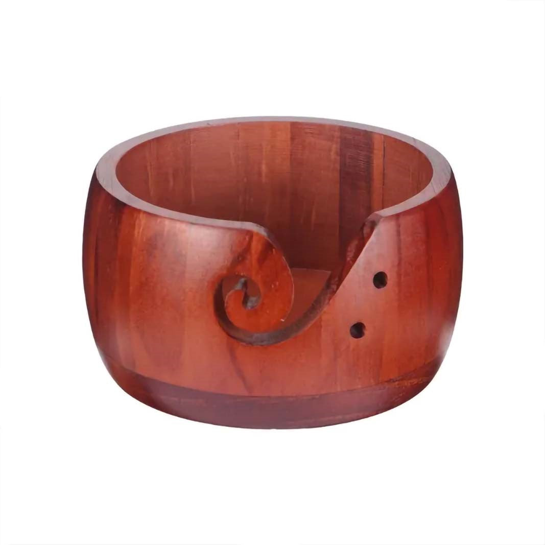 Handmade Wooden Yarn Bowl with a carved spiral design on white background.
