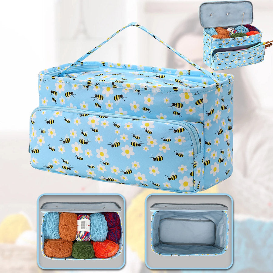 A Large Knitting Bag: Yarn Storage Organizer with a blue floral and bee-patterned design, featuring an open compartment displaying various colorful yarns, a smaller zippered pocket for knitting accessories, and a top handle for easy yarn storage.