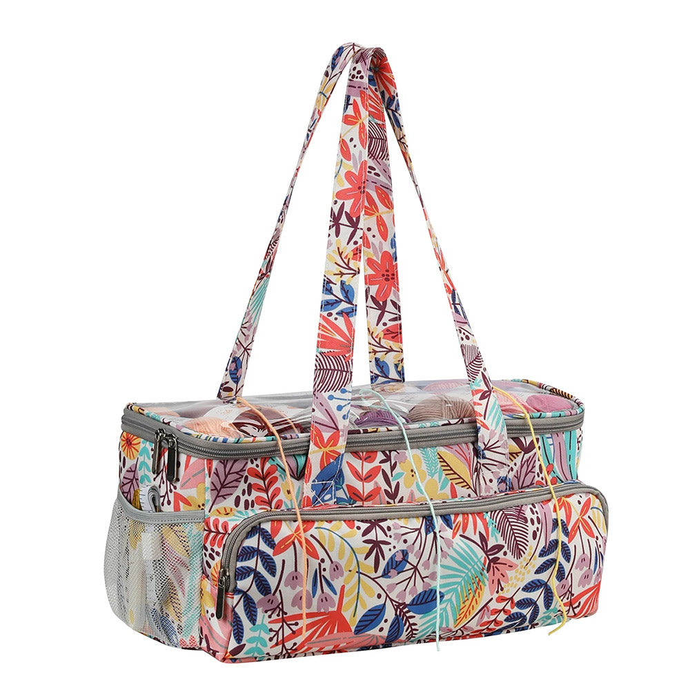 A colorful, floral-patterned Knitting Bag: Yarn Organizer with two handles and a zippered main compartment. Ideal for yarn storage, it features side pockets with mesh material to keep your crafting organizer accessories easily accessible.