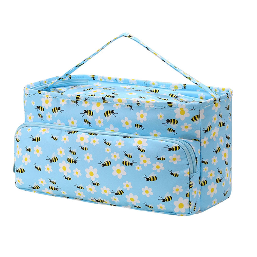 A rectangular light blue Large Knitting Bag: Yarn Storage Organizer with a handle on top, featuring a pattern of yellow bees and white flowers on the exterior. The front has a zippered pocket for knitting accessories, and the main compartment has a zipper closure for secure yarn storage.