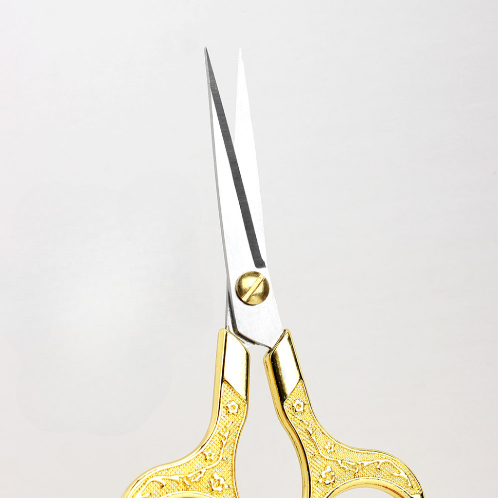 Retro Stainless Steel Yarn Scissors with ornate gold handles and pointed silver blades, ideal for thread cutting or yarn trimming, displayed against a plain white background.