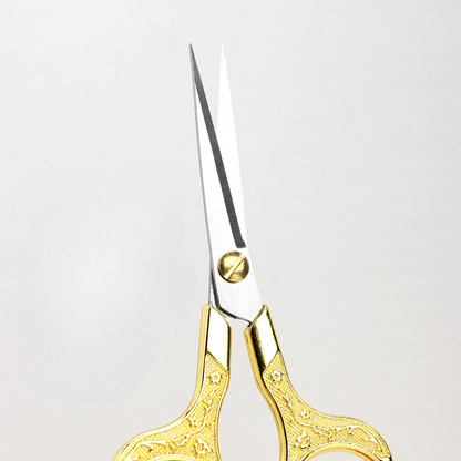 Retro Stainless Steel Yarn Scissors with ornate gold handles and pointed silver blades, ideal for thread cutting or yarn trimming, displayed against a plain white background.