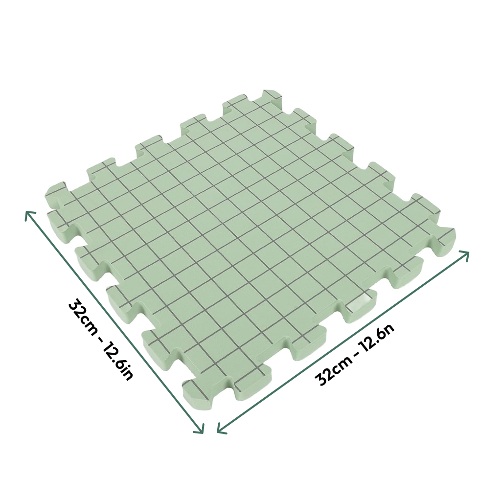 Knitting Crocheting Blocking Mats—square green interlocking foam mat with grid lines, 32 cm x 32 cm (12.6" x 12.6"), shown with arrows for size—perfect as a crochet blocking board for shaping projects accurately.