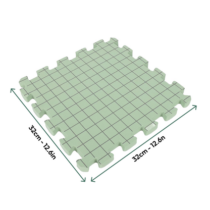 Knitting Crocheting Blocking Mats—square green interlocking foam mat with grid lines, 32 cm x 32 cm (12.6" x 12.6"), shown with arrows for size—perfect as a crochet blocking board for shaping projects accurately.