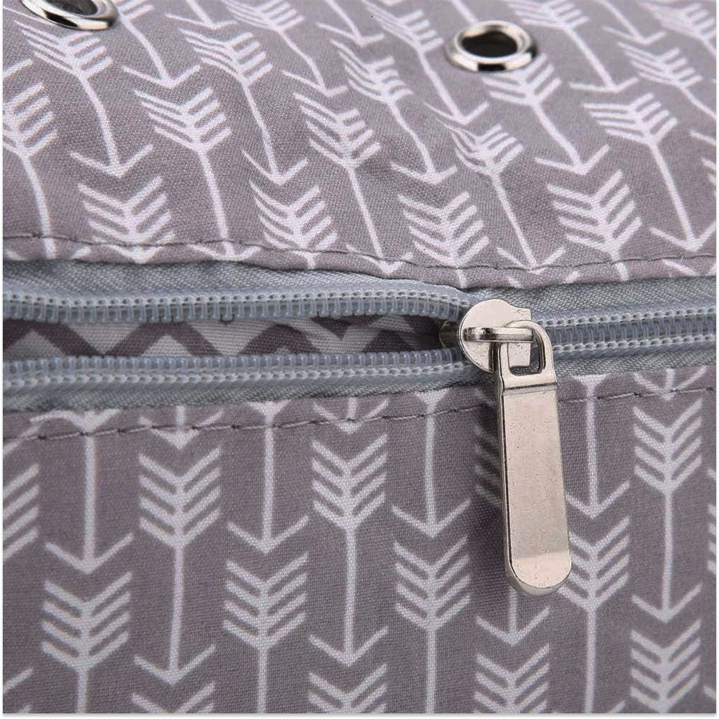 Close-up of the gray fabric with white arrows, silver zipper, and metal grommets on the Portable Knitting Organizer—perfect details for stylish and practical yarn storage for your knitting projects.