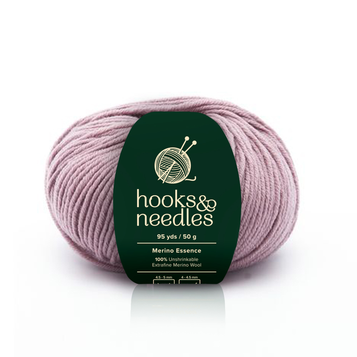 Image of Merino Essence yarn, showcasing its soft texture and natural hues, ideal for creating cozy, elegant knitwear.