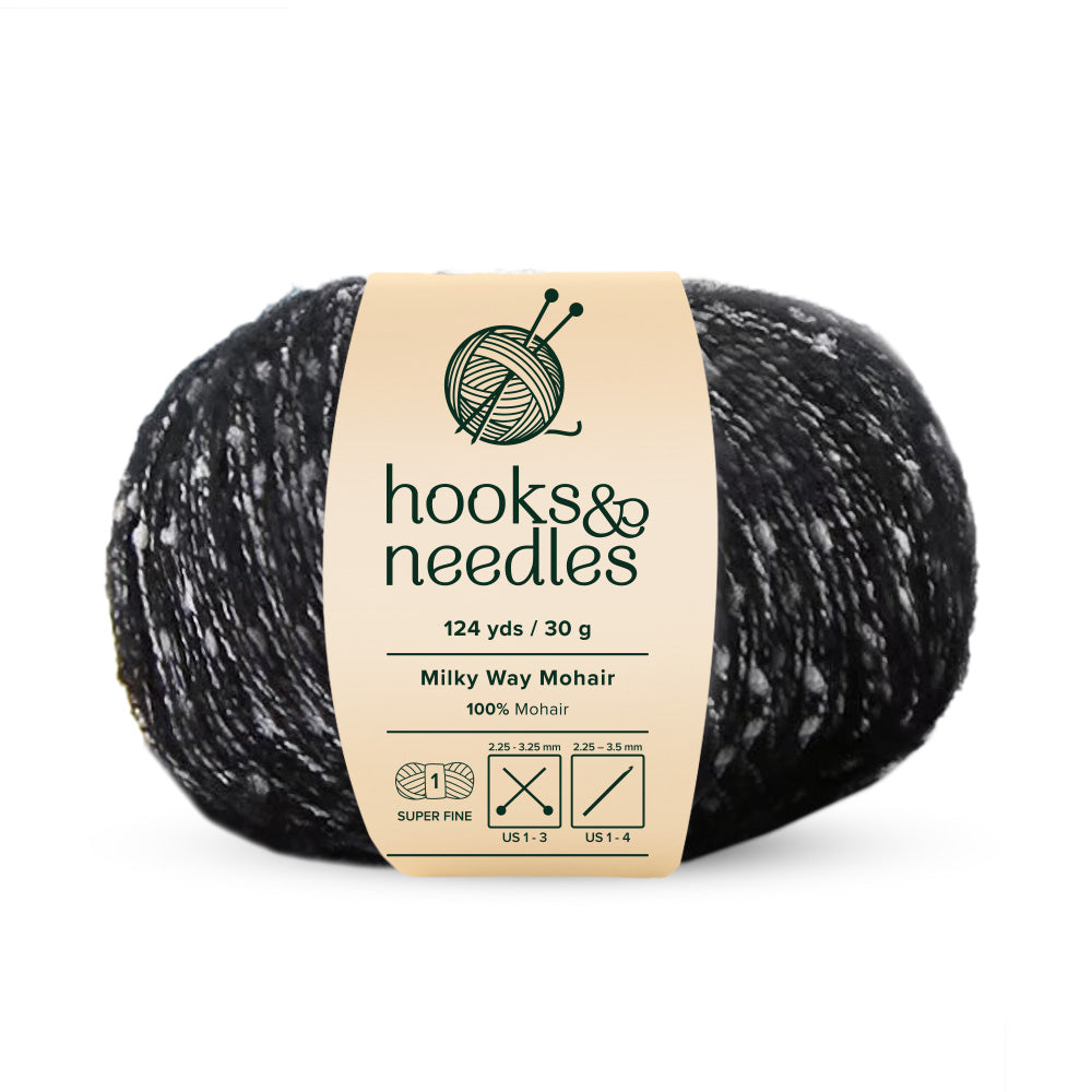 The "Milky Way Mohair Yarn 30g" from hooks & needles is a super fine-weight yarn, featuring 124 yards of luxurious pure black mohair adorned with elegant white speckles, and it weighs only 30 grams.