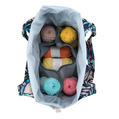 Open Yarn Tote Bag: Knit on The Go containing colorful balls of yarn, neatly organized in compartments, viewed from above. A perfect knitting accessory for all your knitting essentials.