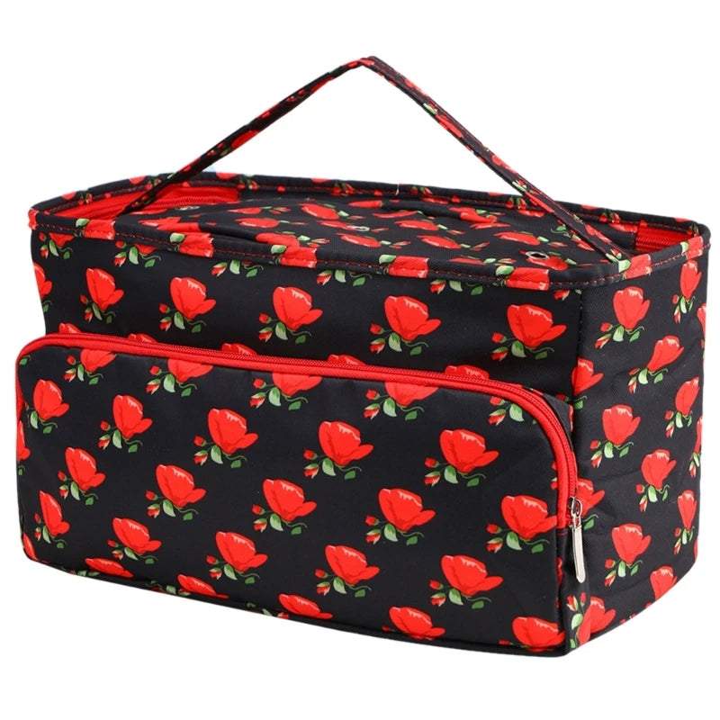 The knitting bag is a rectangular yarn storage organizer featuring a black and red floral pattern, complete with a handle and front zippered pocket, making it ideal for crochet enthusiasts.