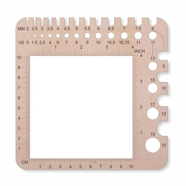 A square needle gauge tool with various-sized holes and measurement markings in millimeters, centimeters, and inches along the edges is the perfect addition to your 29-Piece Crocheting Kit: Perfect for Beginners or Ergonomic Crochet Hook Set.