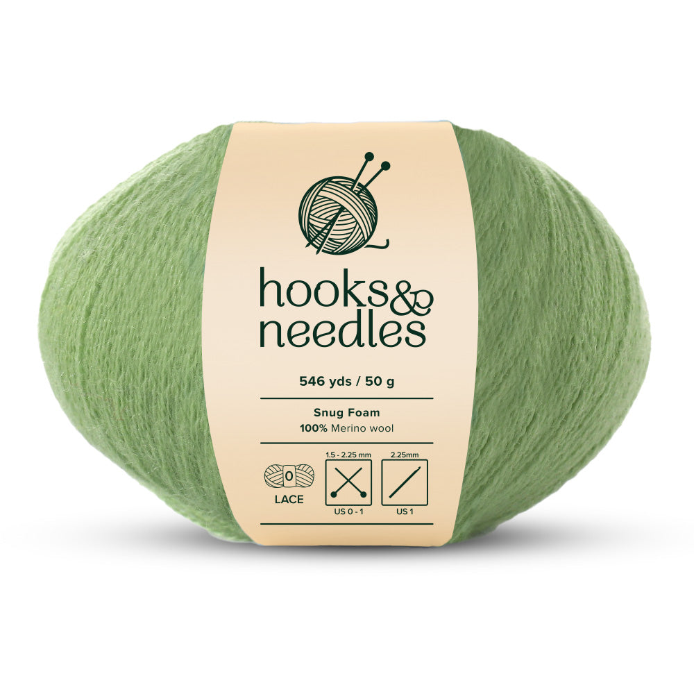 Image of Snug Foam yarn, showcasing its soft texture, ideal for creating cozy, elegant knitwear.