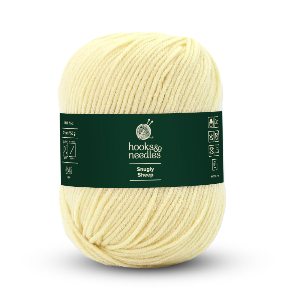 A ball of light-weight pale yellow yarn, meticulously crafted as "Snugly Sheep Yarn 50g" by Hooks & Needles.