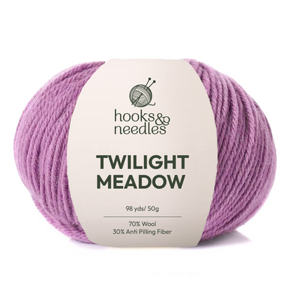 Twilight Meadow Yarn by Hooks & Needles is a 98-yard, 50g skein of medium weight purple yarn, made from a blend of 70% wool and 30% anti-pilling fiber.