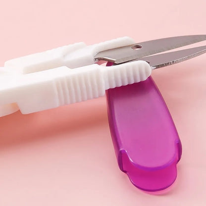 Close-up of an Ergonomic Crochet Hook Set 9 Pcs with Case. The handles are textured for grip, reminiscent of ergonomic crochet hooks, and the background is a solid pink surface.