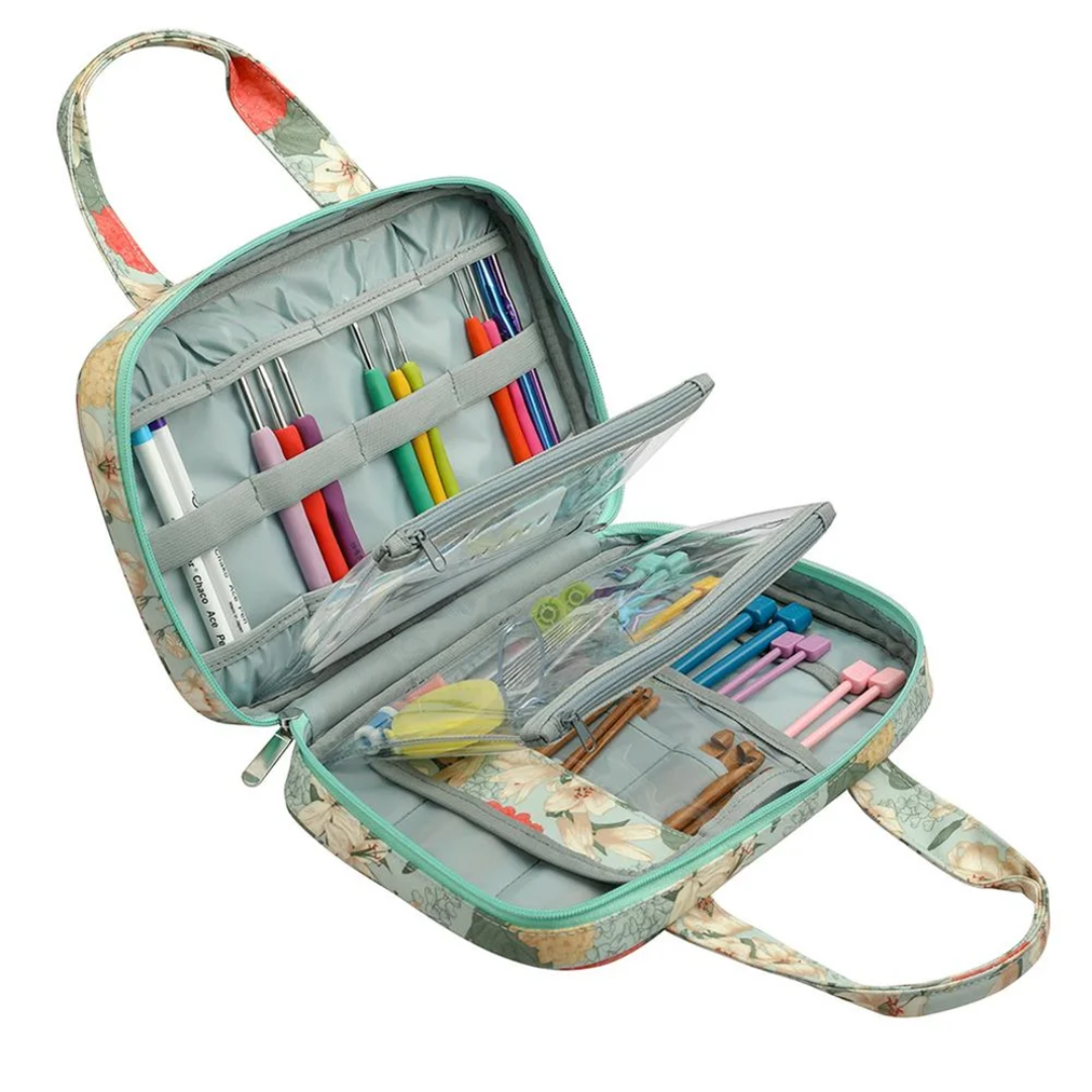 An open Compact Tote Bag displaying colored pencils, markers, and other stationery items.
