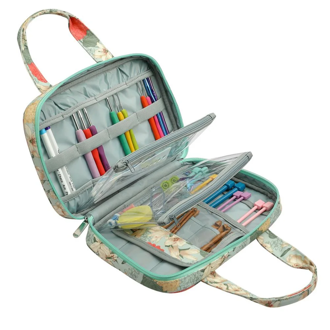 Compact tote bag with various pens, markers, and stationery items neatly organized in compartments—a perfect crafting companion for any creative project.