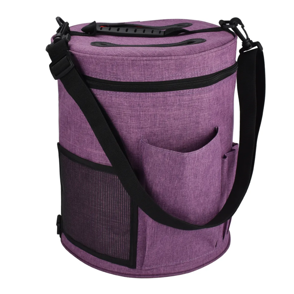 The Yarn Organizer Bag (Bundle9) in purple, ideal for knitters and crocheters, comes with a black shoulder strap, a side mesh pocket for convenient crafting supplies storage, and an extra small pocket to keep essentials within easy reach.