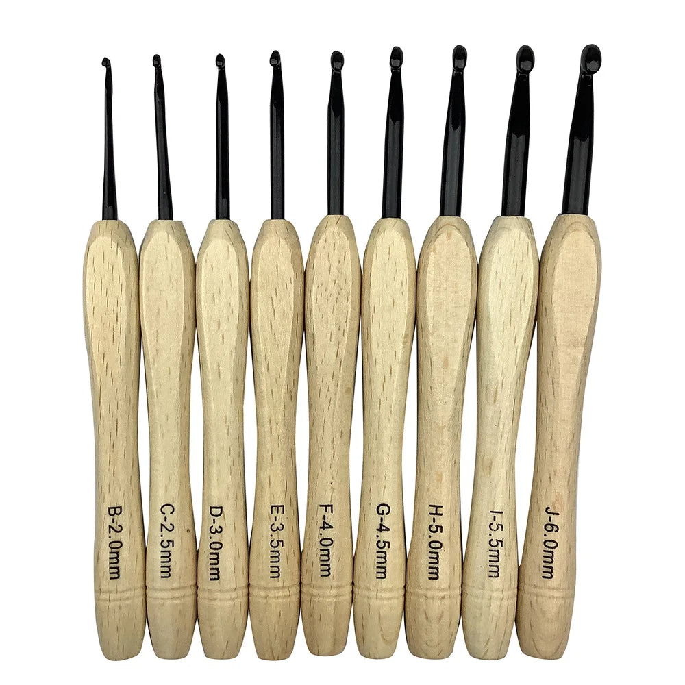 Nine wooden handle crochet hooks, designed with an ergonomic grip for added comfort, are showcased upright with their metal hooks visible, offering sizes ranging from 2.0mm to 6.0mm. Product: Wooden Handle Crochet Hooks 9 Pcs.