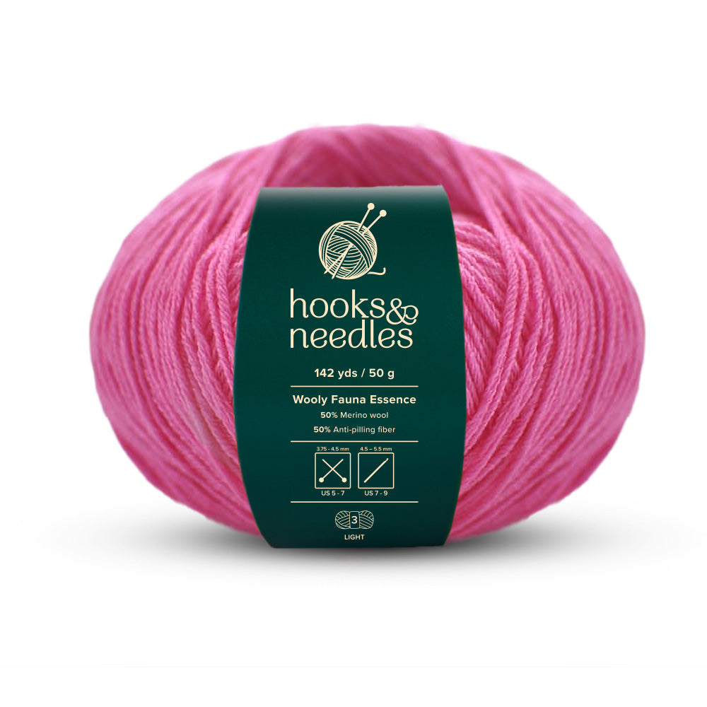 Image of Wooly Fauna Essence yarn, showcasing its soft texture, ideal for creating cozy, elegant knitwear.