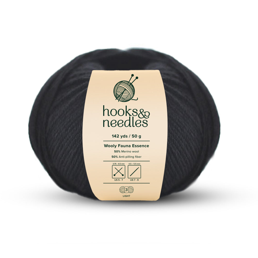 Image of Wooly Fauna Essence yarn, showcasing its soft texture, ideal for creating cozy, elegant knitwear.