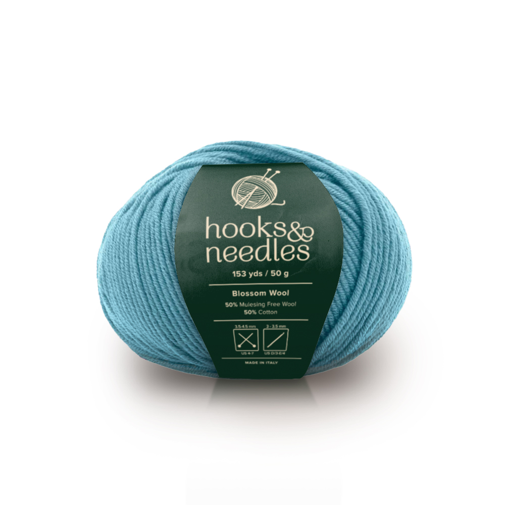 Image of Blossom Wool yarn, showcasing its soft texture and natural hues, ideal for creating cozy, elegant knitwear.