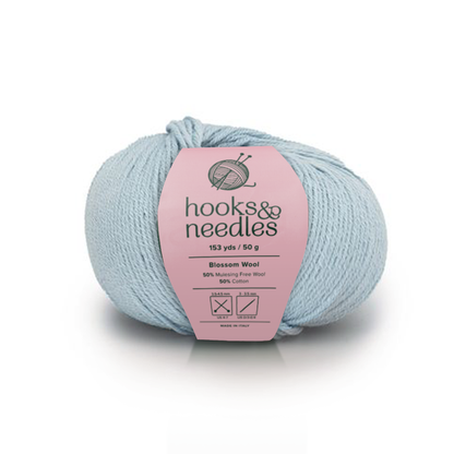 Image of Blossom Wool yarn, showcasing its soft texture and natural hues, ideal for creating cozy, elegant knitwear.