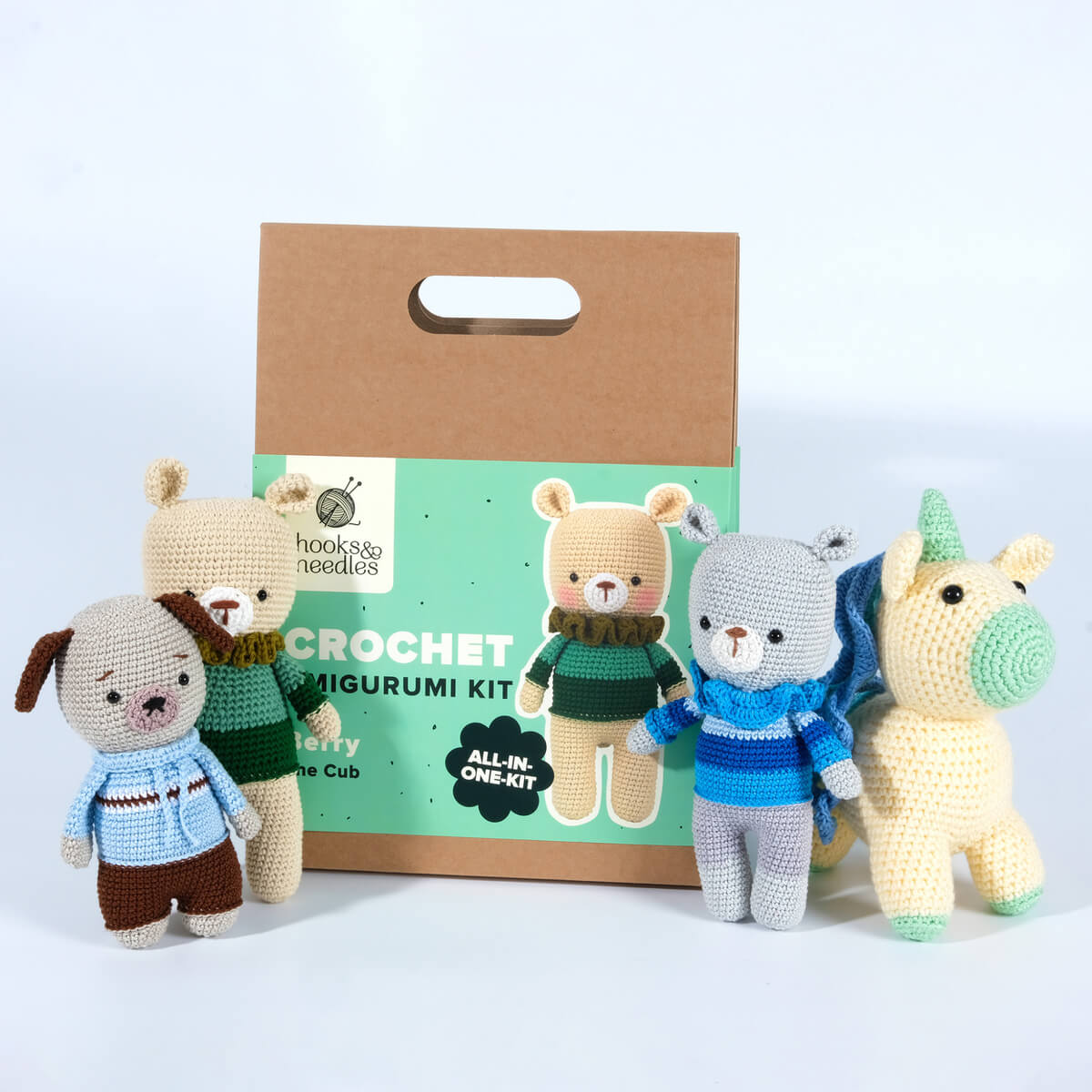 The Amigurumi Subscription Box package is displayed with four assembled animal figures: a dog, two bears, and a unicorn.