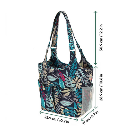 The Yarn Tote Bag: Knit on The Go features a multicolored leaf print, side pockets (17 cm deep), and measures 30.9 cm high, 25.9 cm wide, with a 26.9 cm side—ideal storage for knitters who want style and convenience.