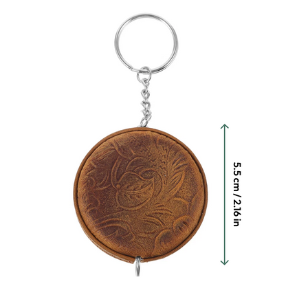 Mini Leather Tape Measure 60" in brown leather with embossed floral pattern and vintage charm, attached to a metal keyring; vertical arrow indicates height of 5.5 cm (2.16 inches).
