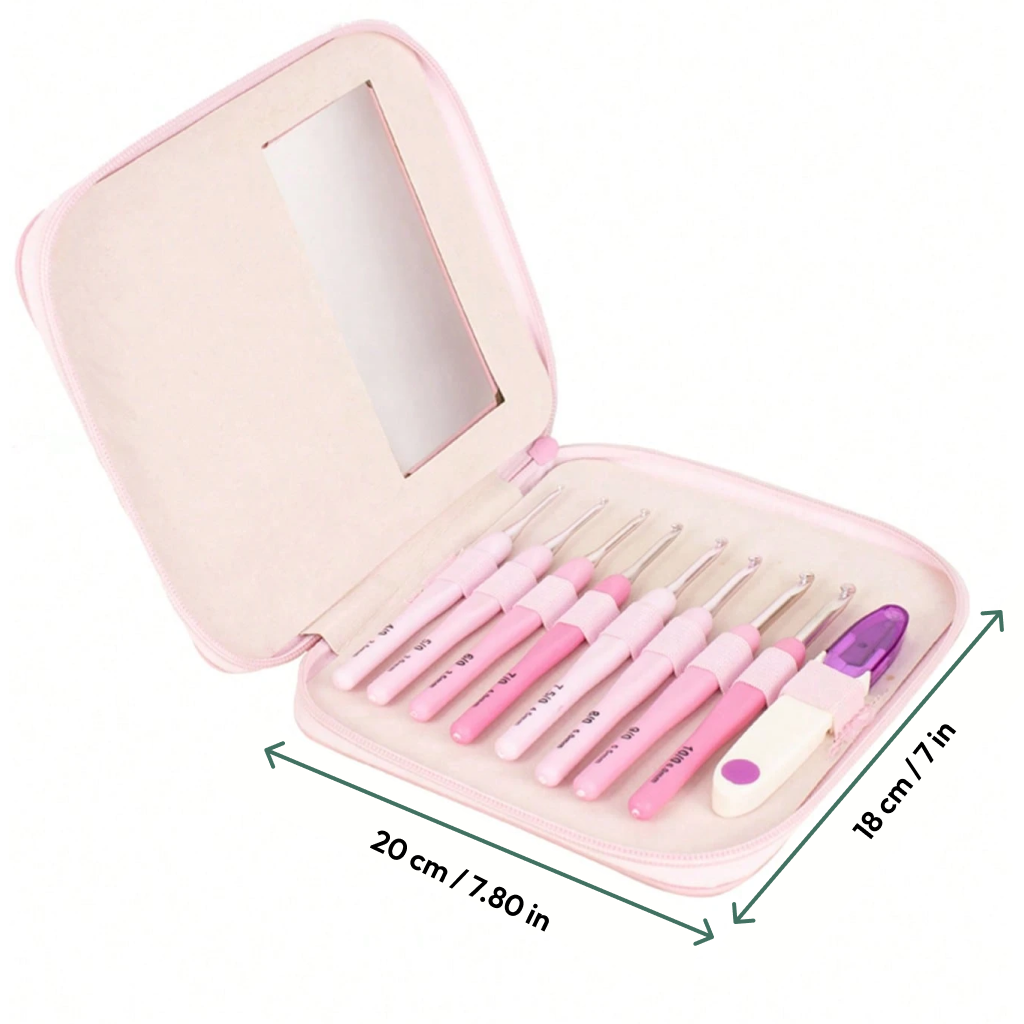 The Ergonomic Crochet Hook Set 9 Pcs with Case includes a pink zippered case (20cm x 18cm), eight crochet hooks with ergonomic handles, scissors, and a measuring tape for convenient storage.